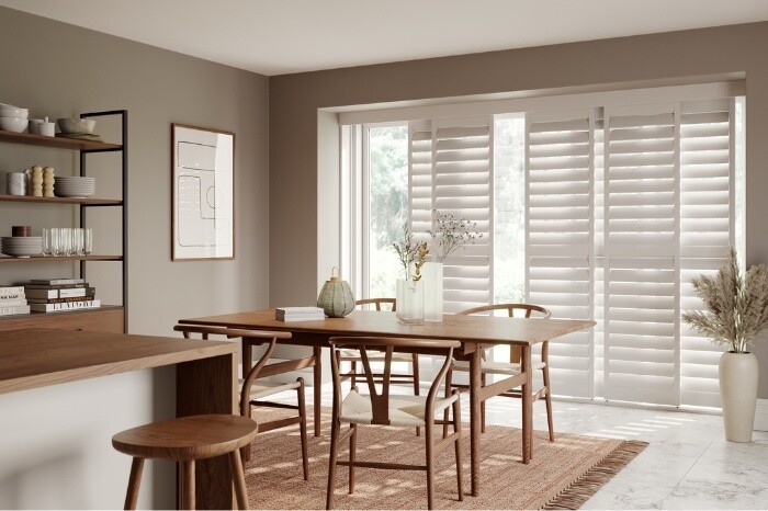 Tracked blinds in dining room