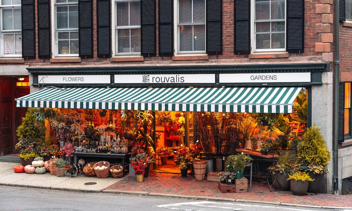 Awning shown over the front of a flower shop